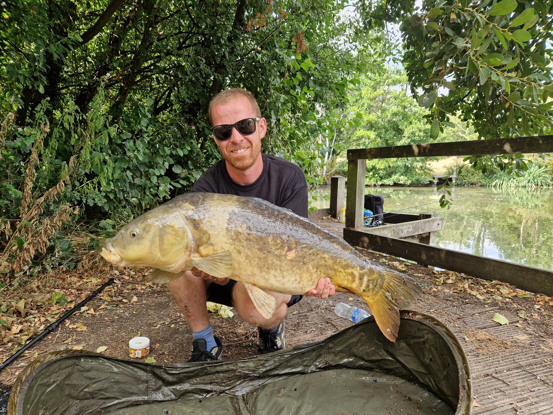 Danny Cowan grinning with the same carp