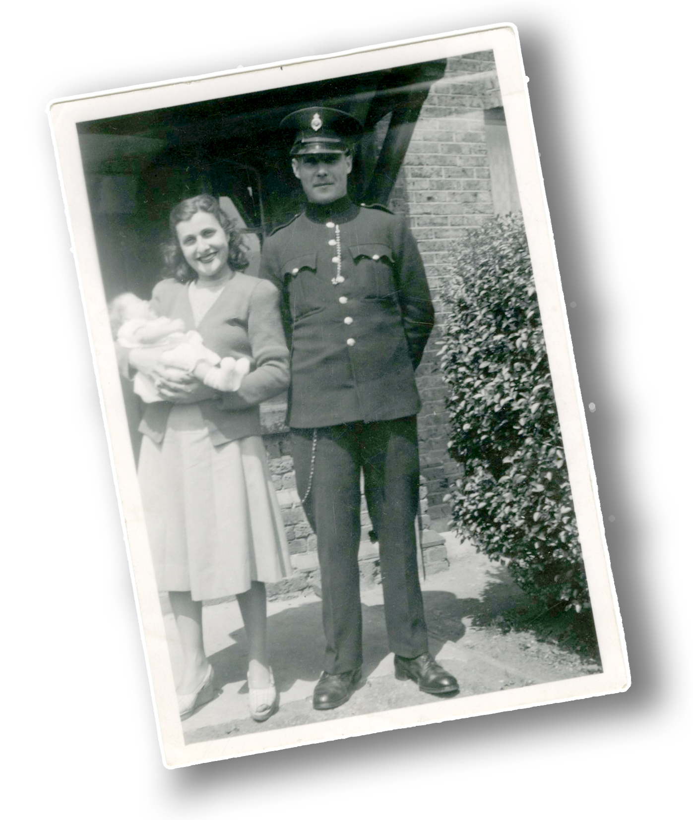 My father in prison officer's uniform and my mother holding me as a baby, outside 13 Heathfield Square, 1949